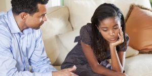 Raise Your Child's Self-Esteem - Father and daughter talking 