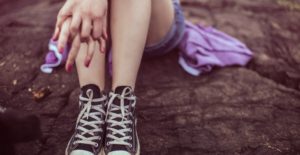 Depression in Teen Girls - Girl Sitting on Rock