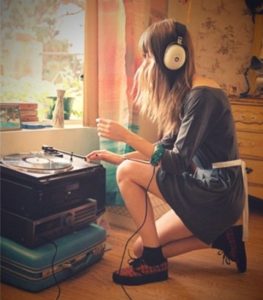 the first year of college - girl listening to records 