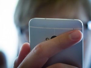 Help your child with cyberbullying - girl with iphone